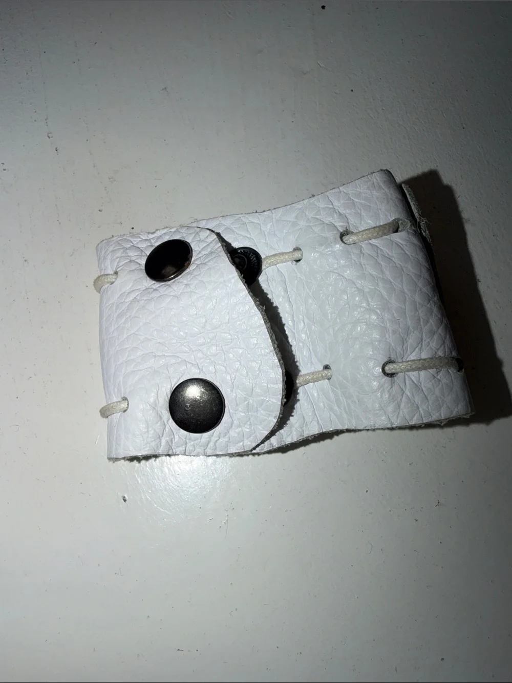 White Leather Wristband Cuff with Dark Stone Accent